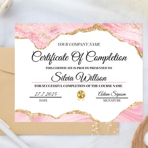May include: A certificate of completion with a pink and gold design. The certificate includes the text "Certificate Of Completion" and "Silvia Willson". The date is 27.7.2025.