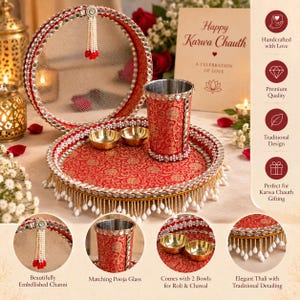 May include: A red and gold patterned Karwa Chauth set featuring a circular mesh channi with a beaded tassel, a matching tumbler, and two small bowls. The items are decorated with small mirrors and white beaded fringe along the edges of the tray.