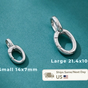 May include: Two silver-toned oval-shaped spring gate rings with a polished finish. The smaller ring measures 14x7mm, and the larger ring measures 21.4x10mm. Each piece features a hinged mechanism for opening and closing, designed for jewelry making.