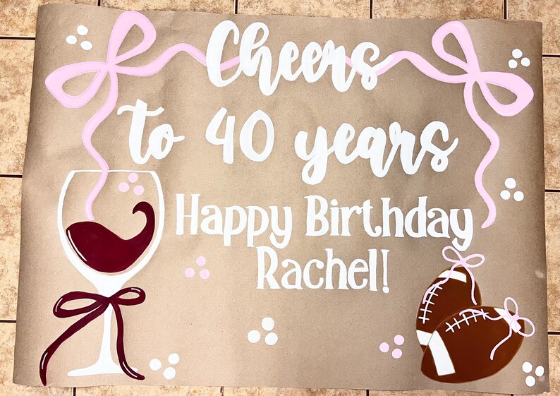 The image is a birthday card for someone's 40th birthday, with a wine glass, football, and a ribbon.