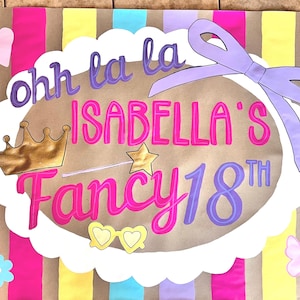 The image is a colorful banner with text and decorative elements, including a crown, a ribbon, and butterflies.