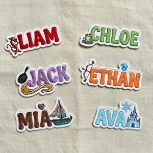 May include: Embroidered name patches in various colors. Names include Liam, Chloe, Jack, Ethan, Mia, and Ava. Each patch features a unique design element, such as a dragon, frog, or sailboat. Perfect for personalizing clothing or accessories.