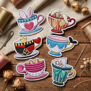 May include: Embroidered patches featuring teacups with whimsical designs. One teacup has bunny ears, another has a bow, and another has a crown. The patches are colorful with various patterns and shapes, perfect for adding to clothing or accessories.