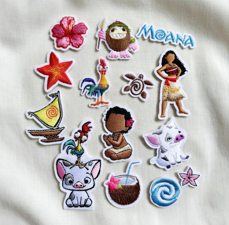 May include: A collection of embroidered patches featuring characters and elements from the animated film "Moana." Includes a pink hibiscus flower, a starfish, a rooster, a turtle, a sailboat, and the word "Moana."