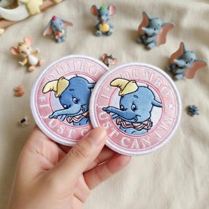 May include: A set of three ceramic mugs with a speckled, matte finish. The mugs are in shades of cream, light gray, and dark gray. Each mug has a simple, minimalist design, perfect for coffee or tea.