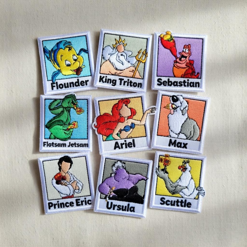 May include: A white ceramic mug with a black handle and the text "But First, Coffee" in a black, bold font. The mug is on a white surface.