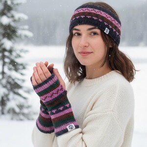 May include: A knitted headband and fingerless gloves set. The headband and gloves feature a pattern of pink, green, and brown stripes on a dark gray background. The gloves have a small white tag with a logo.