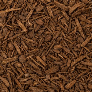 May include: Close-up of brown wood mulch, a landscaping material. The image shows a dense collection of irregularly shaped wood pieces in varying shades of brown. The texture is rough and natural, suitable for gardens and outdoor spaces.