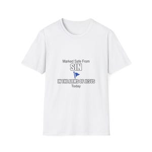 May include: A white short-sleeved t-shirt featuring the black text 'Marked Safe From SIN' above a blue flag icon, followed by the text 'IN THE ARMS OF JESUS' and the word 'Today' printed in black on the center of the chest area.