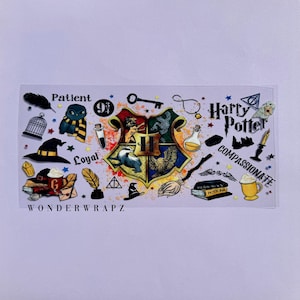 May include: A rectangular sticker sheet featuring a central Hogwarts crest surrounded by various magical icons including an owl, a witch hat, a broomstick, potion bottles, books, and the text Harry Potter, Patient, Loyal, and Compassionate.