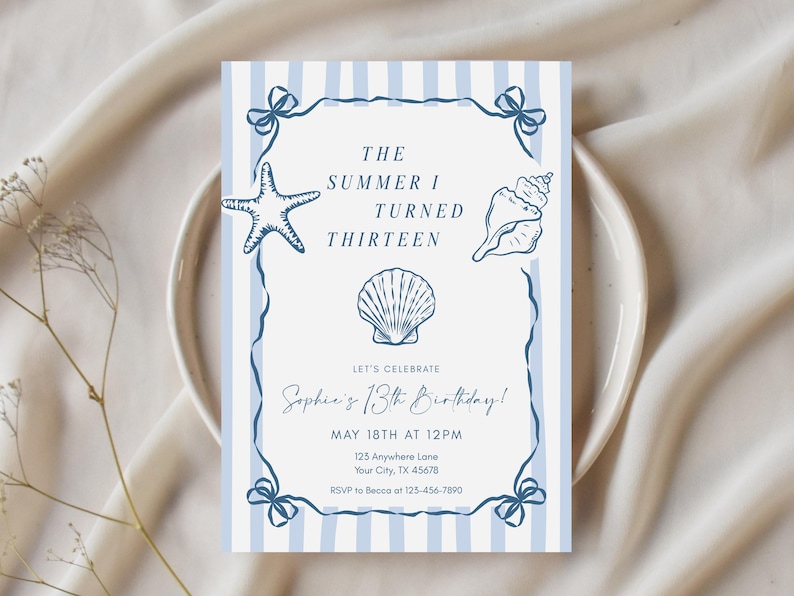 May include: A rectangular invitation card with a light blue and white vertical striped border. The center features dark blue illustrations of a starfish, a conch shell, and a scallop shell. Text reads: THE SUMMER I TURNED THIRTEEN, LET'S CELEBRATE Sophie's 13th Birthday! MAY 18TH AT 12PM, 125 Anywhere Lane, Your City, TX 45678, RSVP to Becca at 123-456-7890.