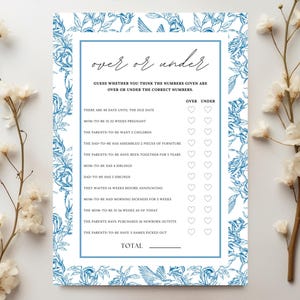 May include: A white card with blue floral border and the text "over or under". The game card has a list of questions with check boxes for "over" or "under". The card is decorated with floral elements.