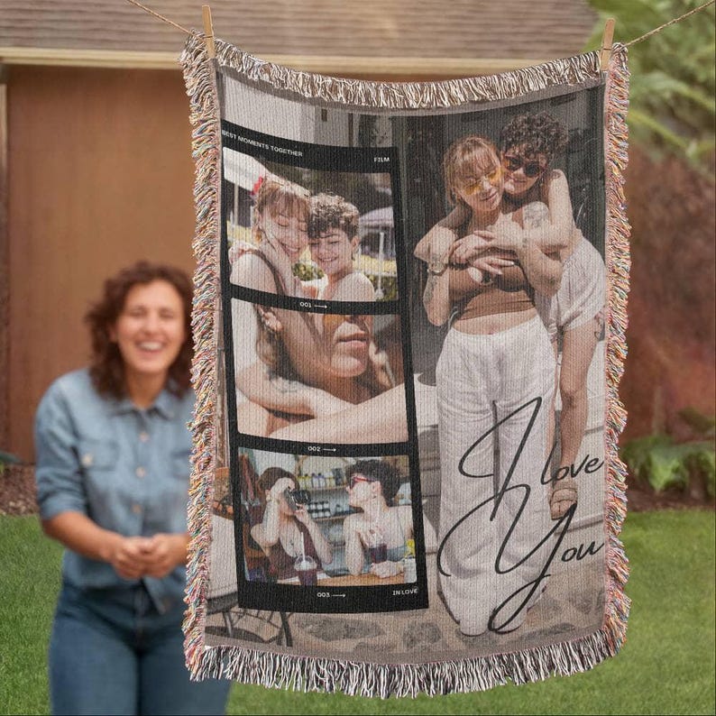 May include: A woven throw blanket with a photo collage of three images and the words "I Love You" in cursive. The photos show people in various poses. The blanket has a fringed edge and is hanging on a clothesline.