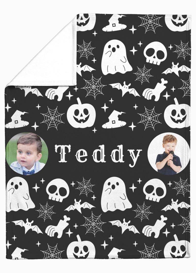 May include: Black Halloween-themed blanket with white illustrations of ghosts, bats, spiderwebs, witch hats, and pumpkins. The name "Teddy" is printed in the center, with two circular photos of a child on either side.