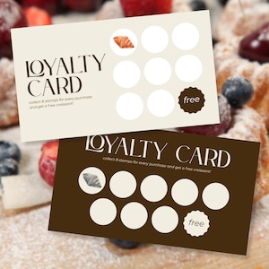 May include: Two loyalty cards with a pastry theme. One card is beige with a watercolour croissant and the text "LOYALTY CARD". The other card is brown with a croissant illustration and the text "LOYALTY CARD". Both cards have circles for stamps and a "free" badge.