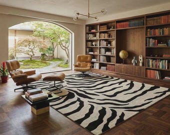 Tapis en laine à motif zèbre noir et blanc tufté à la main, style moderne, idéal pour décorer une pièce.