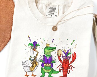 Camiseta retro de Mardi Gras con colores cómodos: divertida camiseta a juego de Mardi Gras con cocodrilo, cangrejo, ganso y flor de lis. Martes Gordo.