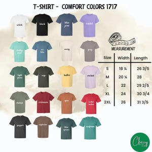 May include: A display of Comfort Colors t-shirts in various colors, including white, black, and blue jean. The image includes a size chart with measurements in inches and the text "T-SHIRT - COMFORT COLORS 1717".