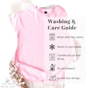 May include: A light pink t-shirt with the text "Washing & Care Guide". The guide includes instructions to wash with like colors, wash in cool water, tumble dry at low-temp, do not bleach, and do not iron design.