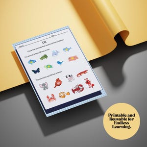 K&ouml;nnte beinhalten: Ein Arbeitsblatt mit dem Text "ODER" und Anweisungen zum Einkreisen von Tieren basierend auf Farbe oder Merkmalen. Das Arbeitsblatt zeigt farbenfrohe Illustrationen verschiedener Tiere, darunter Fische, ein Schmetterling und ein Hummer. Ein gelber Kreis mit dem Text "Druckbar und wiederverwendbar f&uuml;r endloses Lernen."