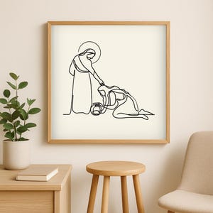 May include: A framed minimalist line art print. The artwork shows a figure with a halo touching the head of a kneeling person. A water jug is between them. The print is in a light wood frame.