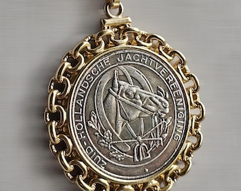 Double-sided Equestrian Horse Coin Pendant encircled in chain-like decor; Reverse side dons Majestic Coat of Arms Shield surrounded by Lions