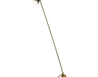 May include: A mid-century modern floor lamp with a black and gold conical shade. The lamp has a slender, brass-colored stem and a small, round base. The lamp's height is approximately 60 inches.