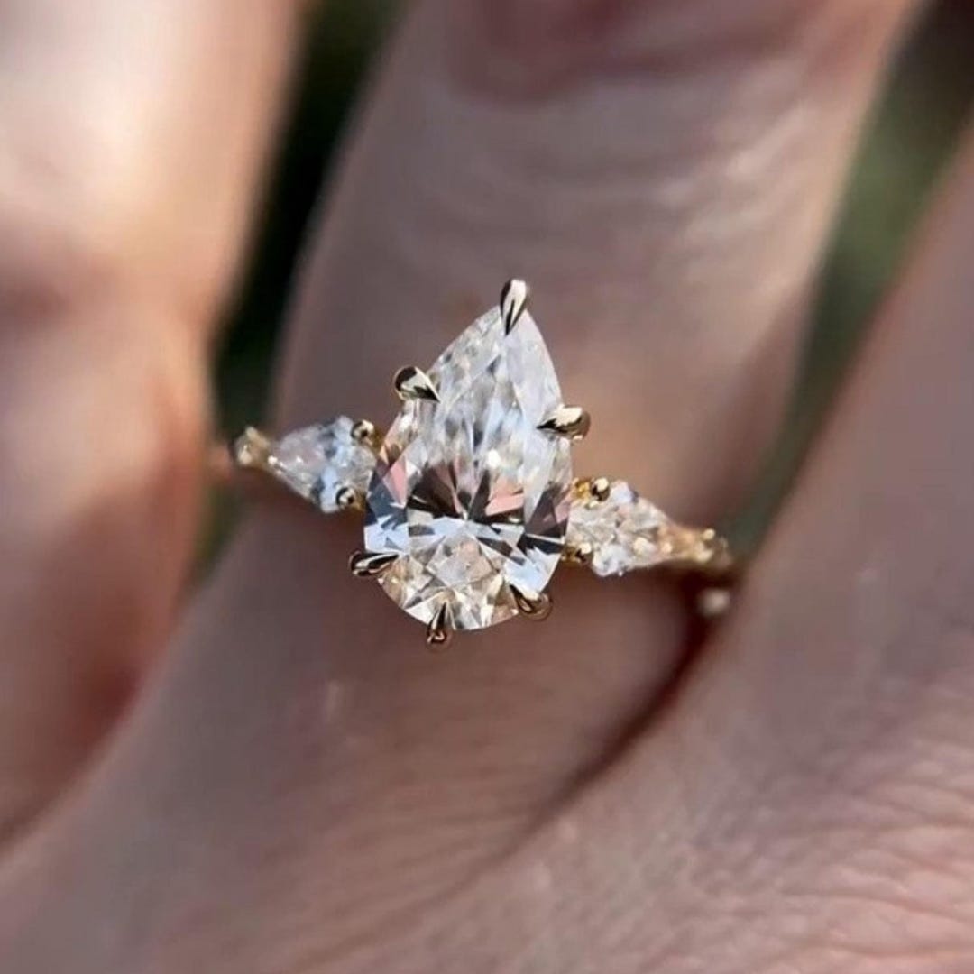 Pear Cut Moissanite Engagement Ring With Kite Accent Side Stone, Prong ...