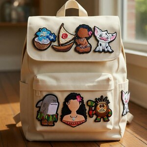 May include: Off-white canvas backpack featuring embroidered patches of cartoon characters and tropical elements. The backpack has a flap closure, a front pocket, and adjustable straps. The patches include a boat, a shark, and a character with a hammer.