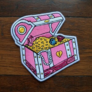 May include: A set of three ceramic mugs with a speckled, matte finish. The mugs are in shades of cream, light gray, and dark gray. Each mug has a simple, minimalist design, perfect for coffee or tea.