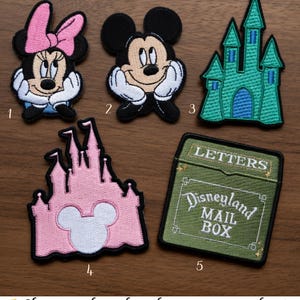 May include: A set of three ceramic nesting bowls in shades of blue, green, and white. The bowls feature a speckled glaze and a simple, modern design. The largest bowl measures approximately 6 inches in diameter.