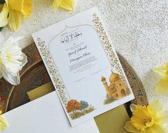 Puede incluir: Un certificado de matrimonio rectangular blanco con bordes florales dorados, un marco arqueado y caligrafía árabe. El texto incluye los nombres Yusuf Ahmed y Maryam Khan, con una ilustración en acuarela de una mezquita dorada.