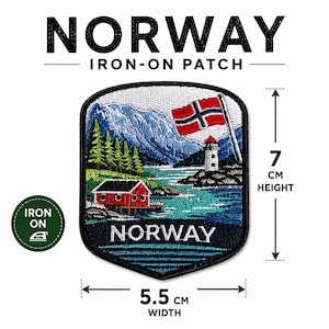 May include: An embroidered iron-on patch featuring a Norwegian landscape with a red cabin, a lighthouse, mountains, and the Norwegian flag. The patch measures 5.5 cm in width and 7 cm in height. The text NORWAY is embroidered at the bottom.