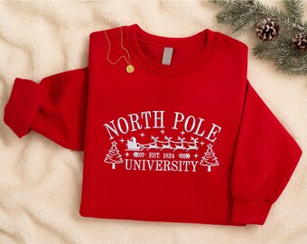 Embroidered North Pole University Sweatshirt, Cozy Christmas Sweatshirt, Winter Holiday Sweatshirt, Gift for Christmas, North Pole Uni Xmas