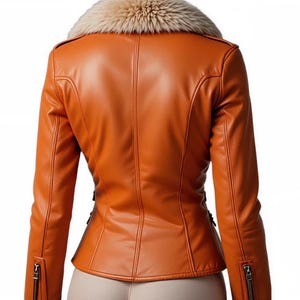 May include: A burnt orange leather jacket with a faux fur collar. The jacket has a fitted silhouette with a zipper closure and zippers on the sleeves. The back view shows the tailored seams and design details.