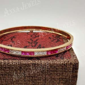 Bransoletka tenisowa ze srebra próby 925 w kolorze złotym, kamienie o wyglądzie rubinu i diamentu