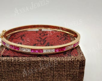 Gold Finish Sterling Silver Tennis Bangle, Ruby Diamond Look Stones