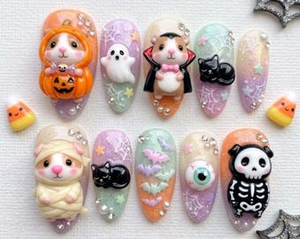 Uñas postizas de Halloween en tonos pastel / Inspiración kawaii adorable / Estilo de uñas almendradas con purpurina / Uñas con murciélagos y telarañas fantasmales / Arte de uñas con dijes de hámster en 3D