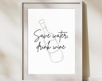 May include: A framed wall art print featuring a black line drawing of a wine bottle angled diagonally. The text Save water, drink wine is written in a black cursive script across the centre of the bottle illustration on a white background.