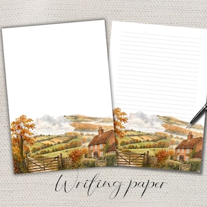 Può includere: Due fogli di carta da lettere bianca con un'illustrazione ad acquerello di un paesaggio rurale con una casa in mattoni, un cancello in legno e alberi autunnali. Un foglio è bianco, l'altro ha righe orizzontali. Una penna nera poggia sul foglio.