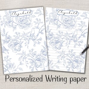 Peut inclure: Deux feuilles de papier à lettres personnalisées avec un motif floral et d'oiseaux bleu sur blanc. Le mot "Elizabeth" est écrit en haut. Une feuille est lignée, l'autre est vierge. Le texte "Personalized Writing paper" est en bas.