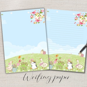Op de afbeelding: Twee vellen schrijfpapier met een grillig ontwerp. De bovenkant van elk vel toont roze vogels op bloeiende takken. De onderste rand heeft cartoon dieren, waaronder eenden en kikkers, op een groene heuvel. De tekst "Writing paper" staat onderaan.