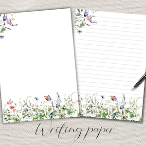 May include: Two sheets of white writing paper with a floral and butterfly design. One sheet is blank, the other has horizontal lines. A black pen rests on the lined paper. The words "Writing paper" are at the bottom.
