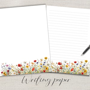 Può includere: Due fogli di carta da scrivere bianchi con un bordo floreale con fiori selvatici rossi, gialli e viola. Un foglio è a righe e una penna nera poggia a destra. Le parole "Writing paper" sono scritte in corsivo.