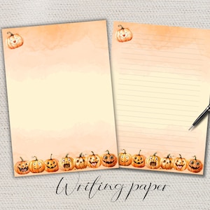 May include: Two sheets of Halloween-themed writing paper. The paper has a light orange watercolor wash at the top and a row of smiling jack-o'-lanterns at the bottom. One sheet is lined, and the other is blank. A black pen rests on the lined sheet.
