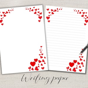 Pode incluir: Duas folhas de papel de escrita branco com um desenho de coração vermelho. Uma folha está em branco e a outra tem linhas horizontais. Uma caneta preta repousa sobre o papel pautado. As palavras "Writing paper" estão escritas em itálico na parte inferior.