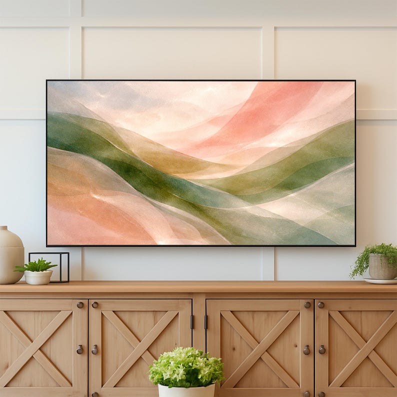 May include: Abstract landscape art print featuring flowing layers of color. The artwork showcases soft hues of green, peach, and beige, creating a serene and calming aesthetic. The piece is framed in a sleek black frame, suitable for home decor.