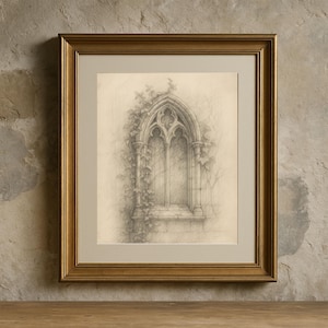 May include: A framed pencil sketch of a gothic window, adorned with climbing ivy. The artwork is set within a gold-colored frame and a neutral-toned mat, creating a classic and elegant aesthetic. The drawing is detailed and realistic.