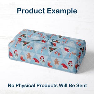 May include: A light blue fabric gift wrap featuring a Christmas pattern of candy canes, gingerbread men, Santa hats, and holly. The text "Product Example" is at the top, and "No Physical Products Will Be Sent" is at the bottom.