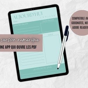 May include: Digital planner displayed on a tablet with a teal and white design. The screen shows a daily planner layout with sections for priorities, notes, and gratitude. A pen rests on the screen. Text on the screen reads "AUJOURD'HUI".